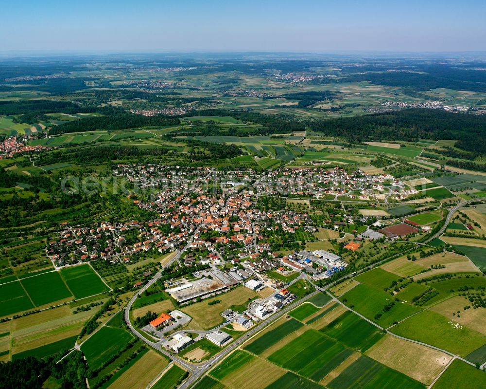 Simmozheim from above - Urban area with outskirts and inner city area on the edge of agricultural fields and arable land in Simmozheim in the state Baden-Wuerttemberg, Germany