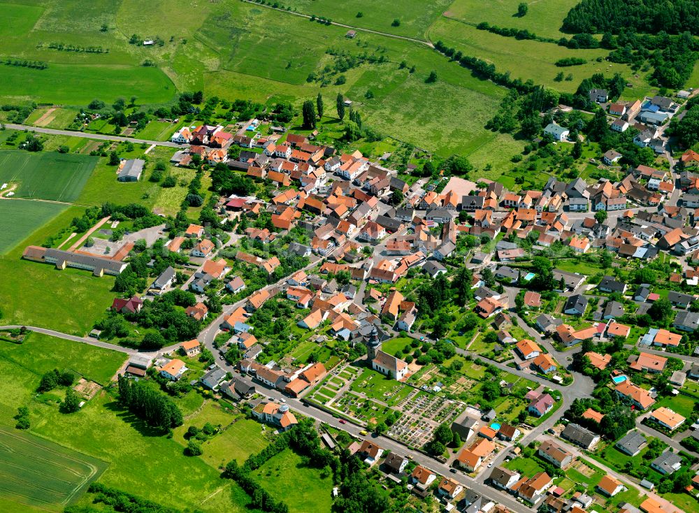 Aerial image Sippersfeld - Urban area with outskirts and inner city area on the edge of agricultural fields and arable land in Sippersfeld in the state Rhineland-Palatinate, Germany