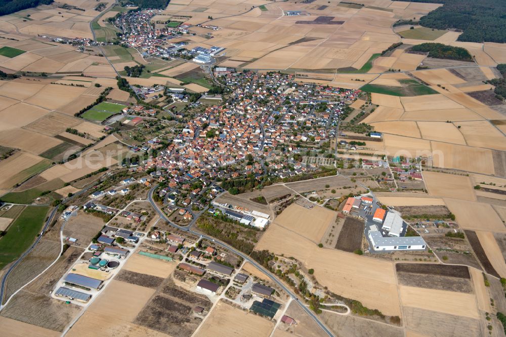 Steinfeld from above - Urban area with outskirts and inner city area on the edge of agricultural fields and arable land in Steinfeld in the state Bavaria, Germany