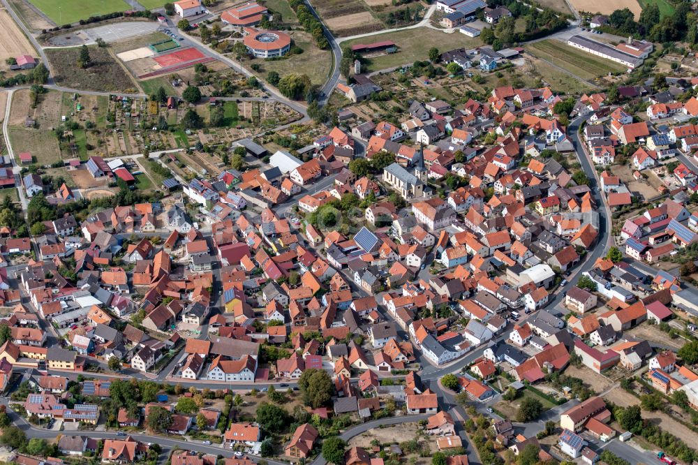 Steinfeld from above - Urban area with outskirts and inner city area on the edge of agricultural fields and arable land in Steinfeld in the state Bavaria, Germany