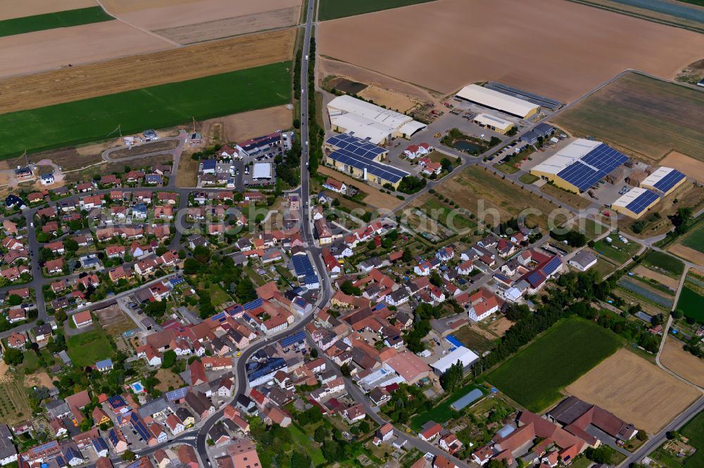 Aerial photograph Unterpleichfeld - Urban area with outskirts and inner city area on the edge of agricultural fields and arable land in Unterpleichfeld in the state Bavaria, Germany