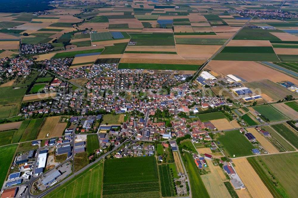 Aerial image Unterpleichfeld - Urban area with outskirts and inner city area on the edge of agricultural fields and arable land in Unterpleichfeld in the state Bavaria, Germany