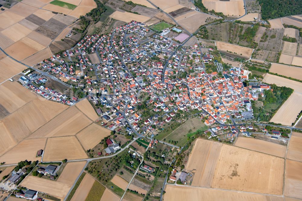 Urspringen from the bird's eye view: Urban area with outskirts and inner city area on the edge of agricultural fields and arable land in Urspringen in the state Bavaria, Germany