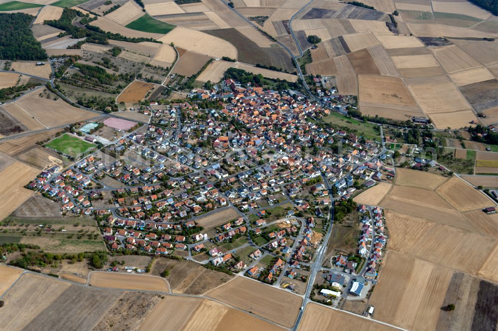 Aerial photograph Urspringen - Urban area with outskirts and inner city area on the edge of agricultural fields and arable land in Urspringen in the state Bavaria, Germany