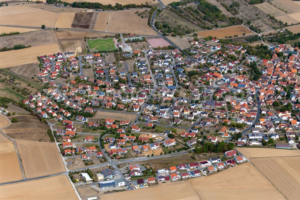 Urspringen from above - Urban area with outskirts and inner city area on the edge of agricultural fields and arable land in Urspringen in the state Bavaria, Germany