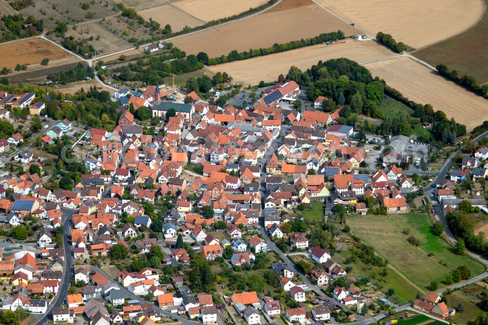 Urspringen from the bird's eye view: Urban area with outskirts and inner city area on the edge of agricultural fields and arable land in Urspringen in the state Bavaria, Germany