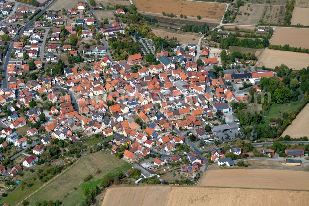 Aerial image Urspringen - Urban area with outskirts and inner city area on the edge of agricultural fields and arable land in Urspringen in the state Bavaria, Germany