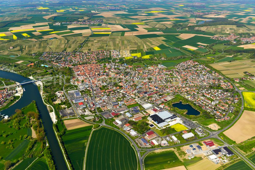 Volkach from the bird's eye view: Urban area with outskirts and inner city area on the edge of agricultural fields and arable land in Volkach in the state Bavaria, Germany