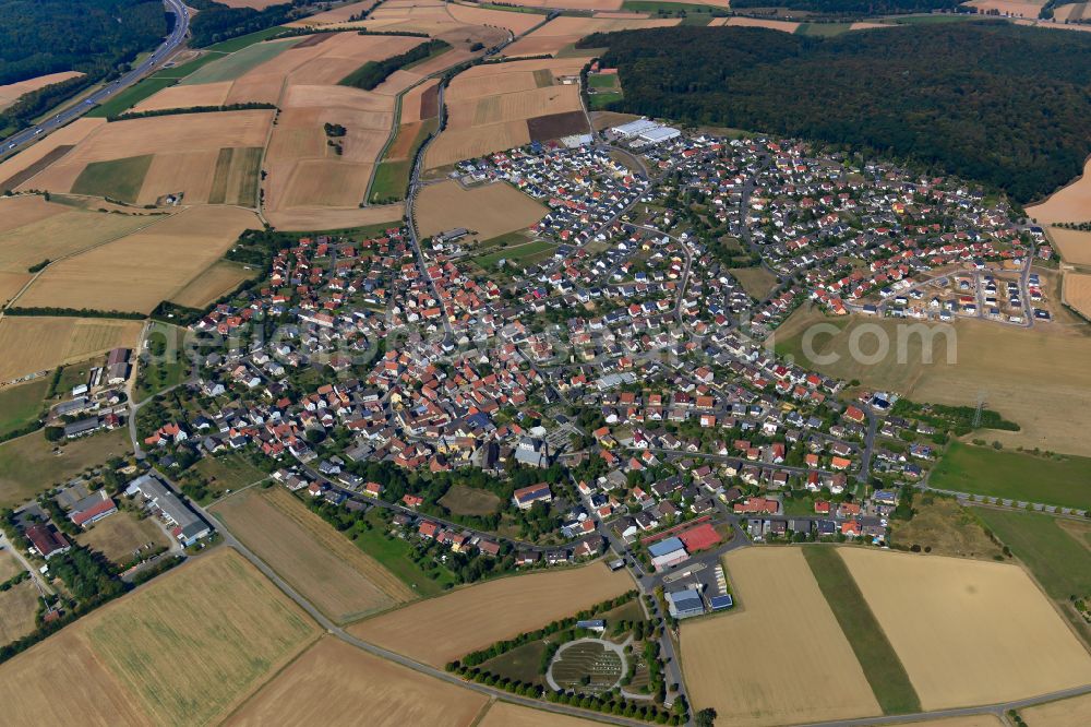 Aerial photograph Waldbrunn - Urban area with outskirts and inner city area on the edge of agricultural fields and arable land in Waldbrunn in the state Bavaria, Germany