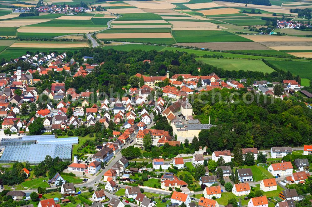 Wallerstein from the bird's eye view: Urban area with outskirts and inner city area on the edge of agricultural fields and arable land in Wallerstein in the state Bavaria, Germany