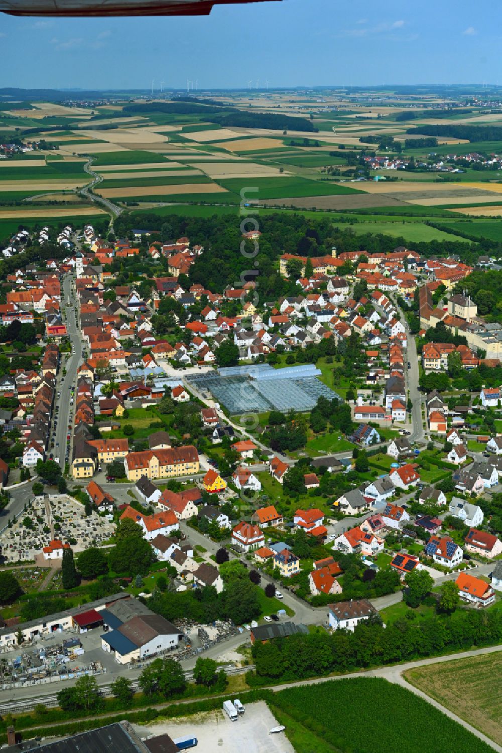 Wallerstein from above - Urban area with outskirts and inner city area on the edge of agricultural fields and arable land in Wallerstein in the state Bavaria, Germany