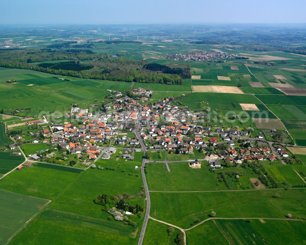 Weitershain from the bird's eye view: Urban area with outskirts and inner city area on the edge of agricultural fields and arable land in Weitershain in the state Hesse, Germany