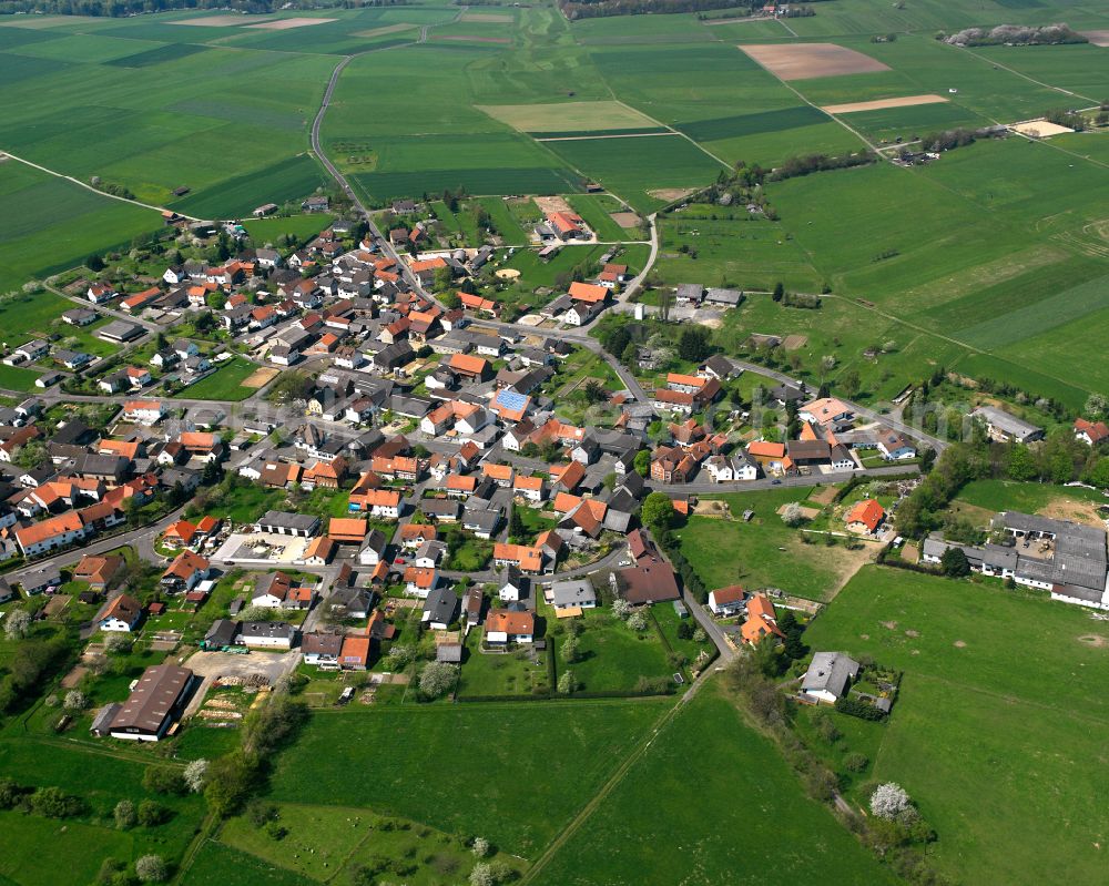 Weitershain from the bird's eye view: Urban area with outskirts and inner city area on the edge of agricultural fields and arable land in Weitershain in the state Hesse, Germany