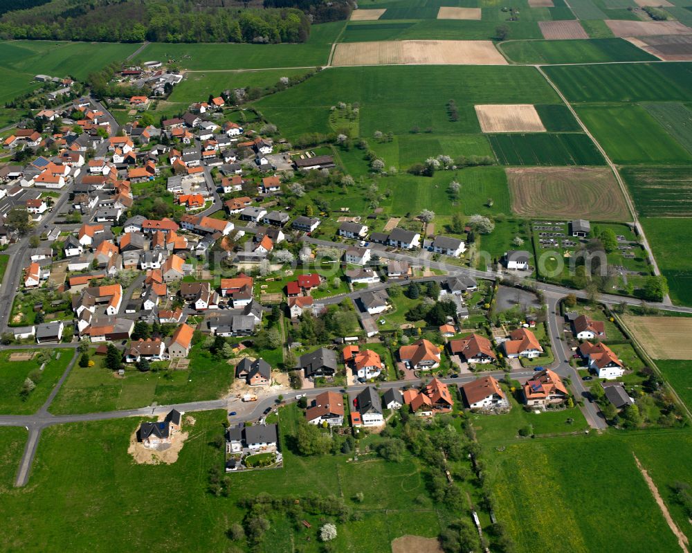 Aerial image Weitershain - Urban area with outskirts and inner city area on the edge of agricultural fields and arable land in Weitershain in the state Hesse, Germany