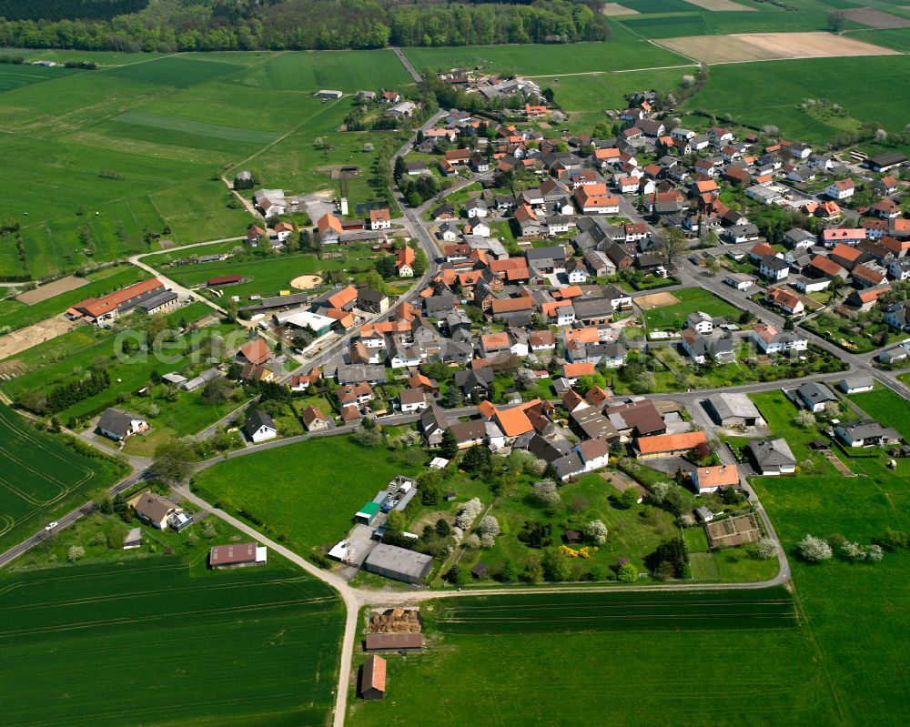 Aerial photograph Weitershain - Urban area with outskirts and inner city area on the edge of agricultural fields and arable land in Weitershain in the state Hesse, Germany