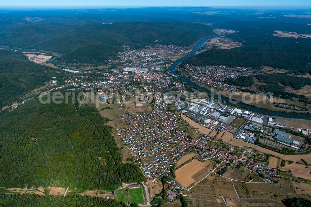 Wombach from the bird's eye view: Urban area with outskirts and inner city area on the edge of agricultural fields and arable land in Wombach in the state Bavaria, Germany