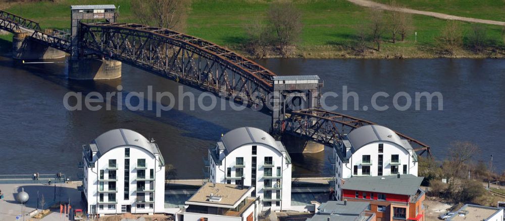 Magdeburg from above - Magdeburg 3/28/2012 view newly built townhouses / town houses on the banks of the Elbe opposite the historic lift bridge