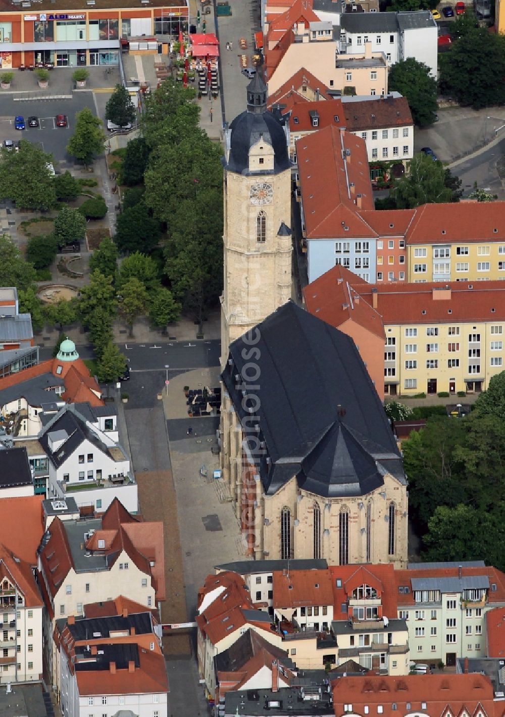 Jena from the bird's eye view: The Church of St. Michael is located directly on the market of Jena in Thuringia. The three-aisled hall church founded as a Cistercian monastery church in the Middle Ages is marked by the architectural style of the Gothic