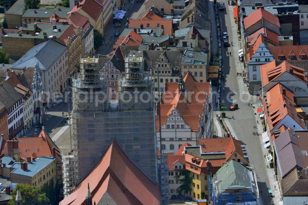 Aerial image Lutherstadt Wittenberg - Blick auf die in Sanierungsarbeiten befindliche Stadtkirche Sankt Marien und das Rathaus von Lutherstadt Wittenberg am Markt im Bundesland Sachsen-Anhalt. View of the parish church sanit marien situated in restauration works and the townhall of Lutherstadt Wittenberg at the market in the state Saxony-Anhalt.