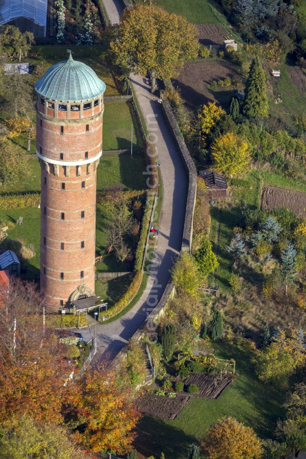 Aerial image Rüthen - View of remains of the town wall of Ruethen with the water tower, build in 1909, surrounded by autumnal green space in the state North Rhine-Westphalia