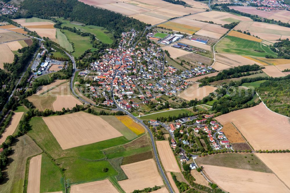 Gössenheim from above - City view from the outskirts with adjacent agricultural fields in Goessenheim in the state Bavaria, Germany