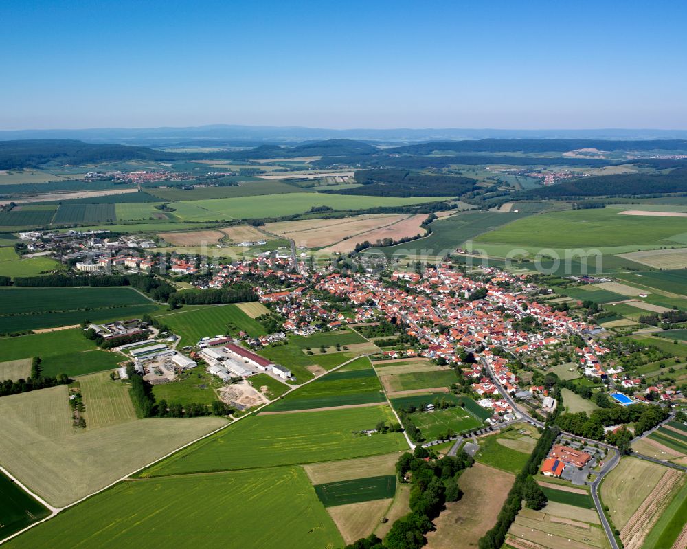 Niederorschel from the bird's eye view: City view from the outskirts with adjacent agricultural fields in Niederorschel in the state Thuringia, Germany