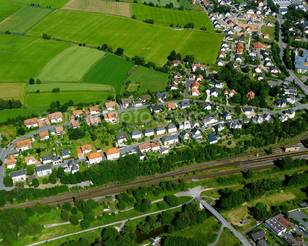 Oberkotzau from the bird's eye view: City view from the outskirts with adjacent agricultural fields on street Hochstrasse in Oberkotzau in the state Bavaria, Germany