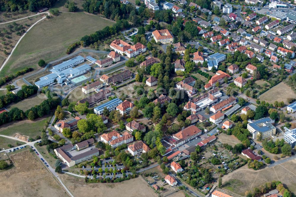 Aerial photograph Wombach - City view from the outskirts with adjacent agricultural fields in Wombach in the state Bavaria, Germany