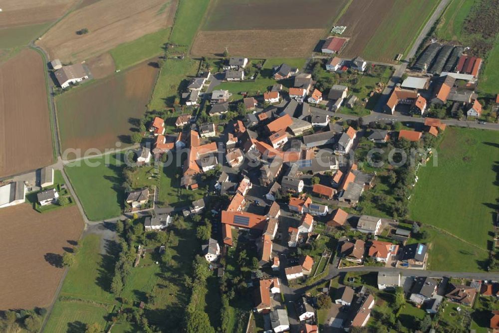 Aerial image Erfurtshausen - Blick auf Erfurtshausen, einem Stadtteil von Amöneburg. Amöneburg ist eine Stadt im Landkreis Marburg-Biedenkopf in Hessen (Deutschland). Sie liegt auf einem Berg rings um die gleichnamige Burg Amöneburg. Die Stadt hat ursprünglich Ihren Namen von dem in der Nähe vorbeifliessenden Fluss Ohm und von der auf der Kuppe des ehemaligen Vulkans liegenden Burg.