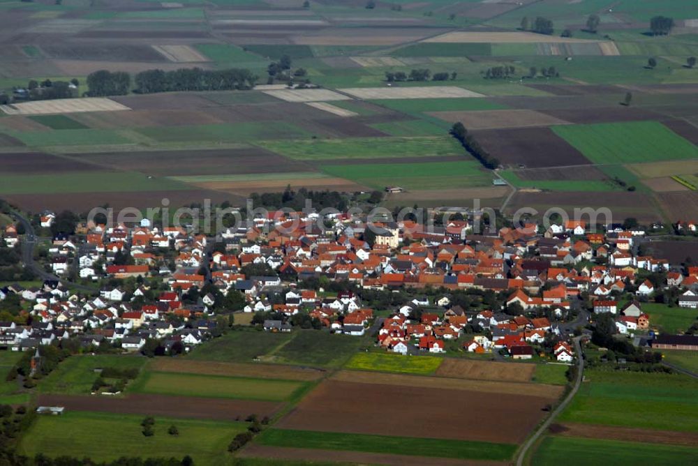 Aerial photograph Erfurtshausen - Blick auf Erfurtshausen, einem Stadtteil von Amöneburg. Amöneburg ist eine Stadt im Landkreis Marburg-Biedenkopf in Hessen (Deutschland). Sie liegt auf einem Berg rings um die gleichnamige Burg Amöneburg. Die Stadt hat ursprünglich Ihren Namen von dem in der Nähe vorbeifliessenden Fluss Ohm und von der auf der Kuppe des ehemaligen Vulkans liegenden Burg.