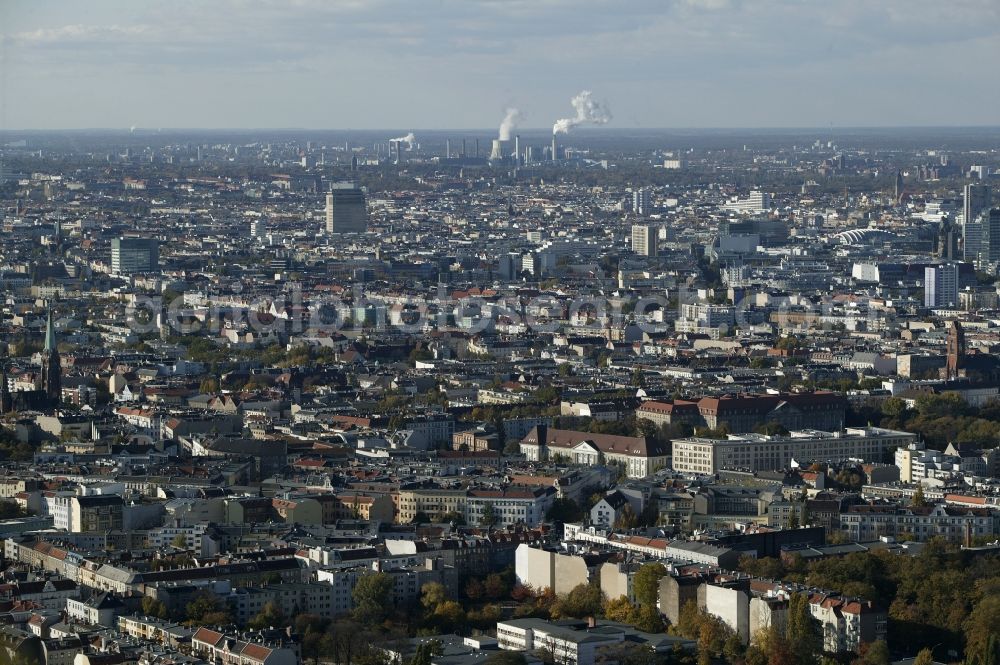 Berlin from above - From the Schoeneberg district of Berlin in the state of Berlin the west view is across the roofs of houses, churches and skyscrapers of downtown Berlin. In the foreground the monumental buildings of the Court of Appeal in Berlin and the University of the Arts are visible on Kleist Park. Behind this is the red brick executed the Catholic St. Matthias Church at Winterfeldtplatz. At one end of the Kaiser Wilhelm Memorial Church and some of the skyscrapers of the City West can be seen. The towers of the Town Hall and Castle Charlottenburg is available near the power plant Reuter. Behind the city district of Spandau begins