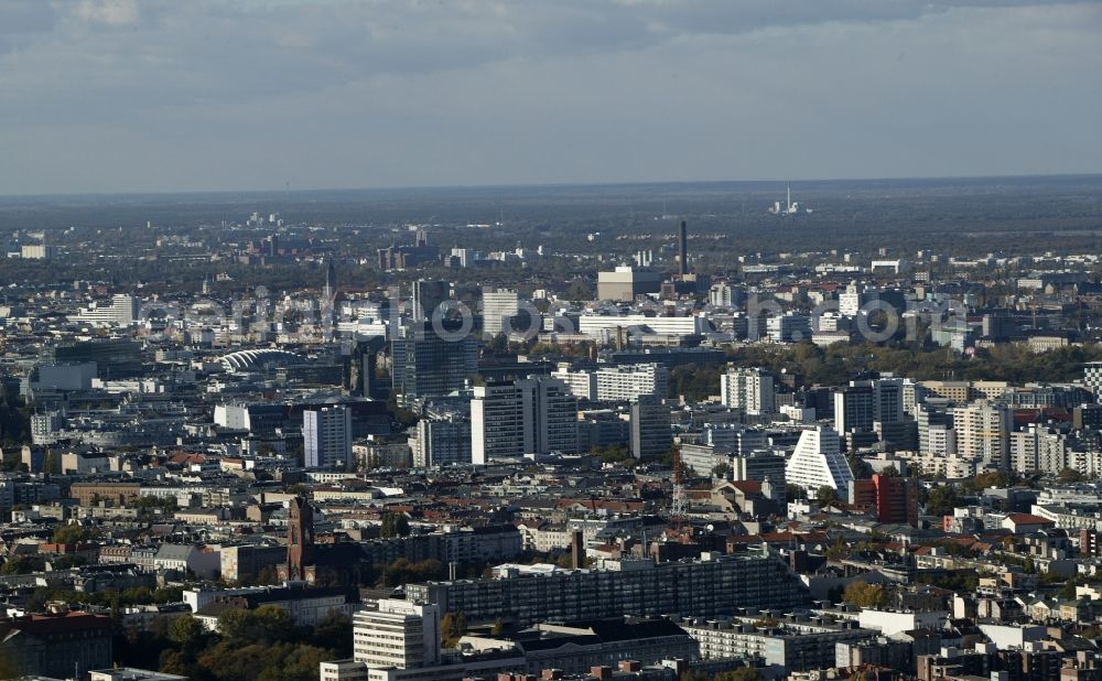 Berlin from above - The Schoeneberg district of Berlin in the state of Berlin is characterized by densely populated residential areas with apartment buildings that were built around the end of the 19th century. Towards the city center are increasingly new buildings. The Pallaseum - Social Palace, an erected by the architect Juergen Sawade plate spanning the Pallas Street. Behind this is the red brick executed the Catholic St. Matthias Church at Winterfeldtplatz. In the background the Kaiser Vilém Memorial Church, the Chamber of Commerce building and some of the skyscrapers of the City West can be seen