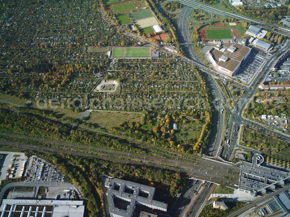 Berlin from above - District Schoeneberg with garden plots Glueck im Winkel eV along the Vorarlberger Damm near federal highway BAB A 100 in the city in Berlin. In the picture as well the suburban train station Suedkreuz