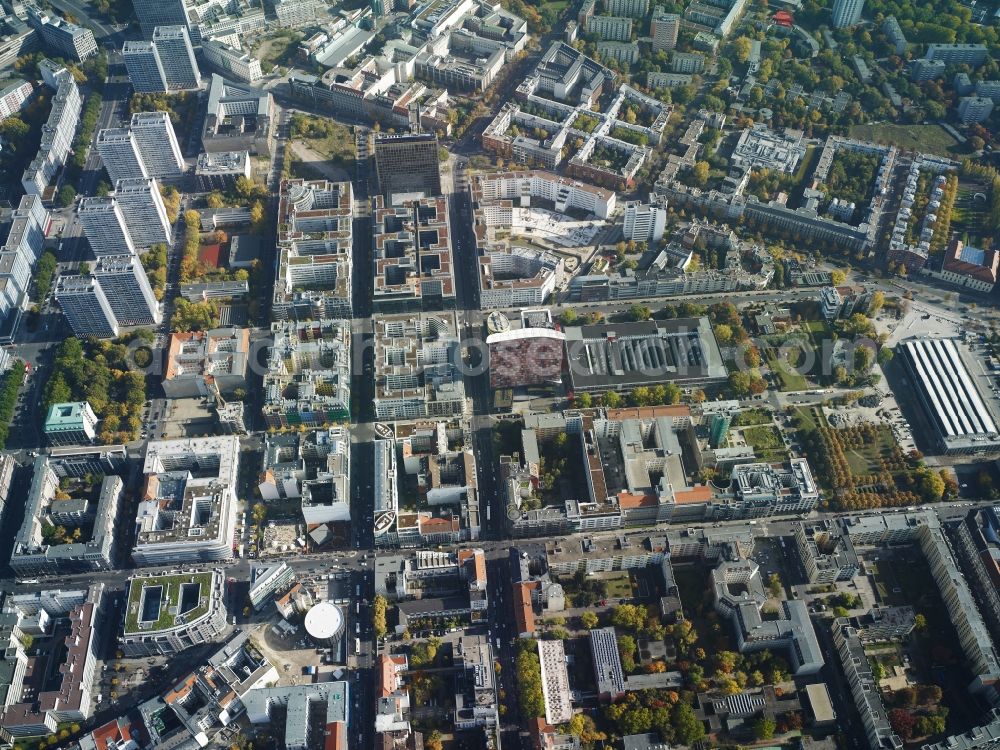 Berlin from above - Quarter south of Leipziger Strasse in the Kreuzberg district of Berlin. Kochstrasse in the West becomes Rudi-Dutschke-Strasse in the East when meeting Friedrichstrasse. There are several important buildings located on Rudi-Dutschke-Strasse: the editorial offices of taz, the distinct colourful and bent GSW-Building and the Axel-Springer-Arcades with their eight courtyards. Several apartment high rises are located on Leipziger Strasse