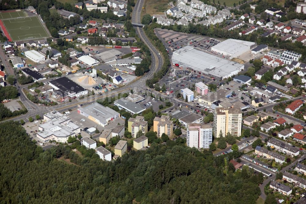 Aerial image Taunusstein - District in the urban area in Taunusstein in Hesse with residential buildings, high-rise buildings and industrial area