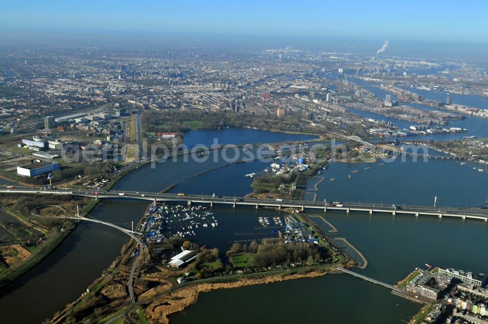 Aerial image Amsterdam - View of the Amsterdam – Rhine Canal in Amsterdam in the province of North Holland in the Netherlands. The river is spanned by the bridges Nesciobrug and Zeeburgerbrug