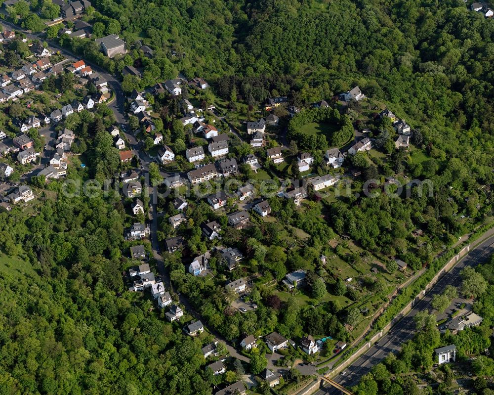 Koblenz from the bird's eye view: View of the Asterstein part of Koblenz in the state Rhineland-Palatinate. Koblenz is located on both sides of the rivers Rhine and Moselle and is surrounded by hills and fields. It is a university town and one of the oldest towns of Germany. The Asterstein part is located on the right riverbank of the Rhine and is mainly a residential area. It is home to the firefighters school of the state