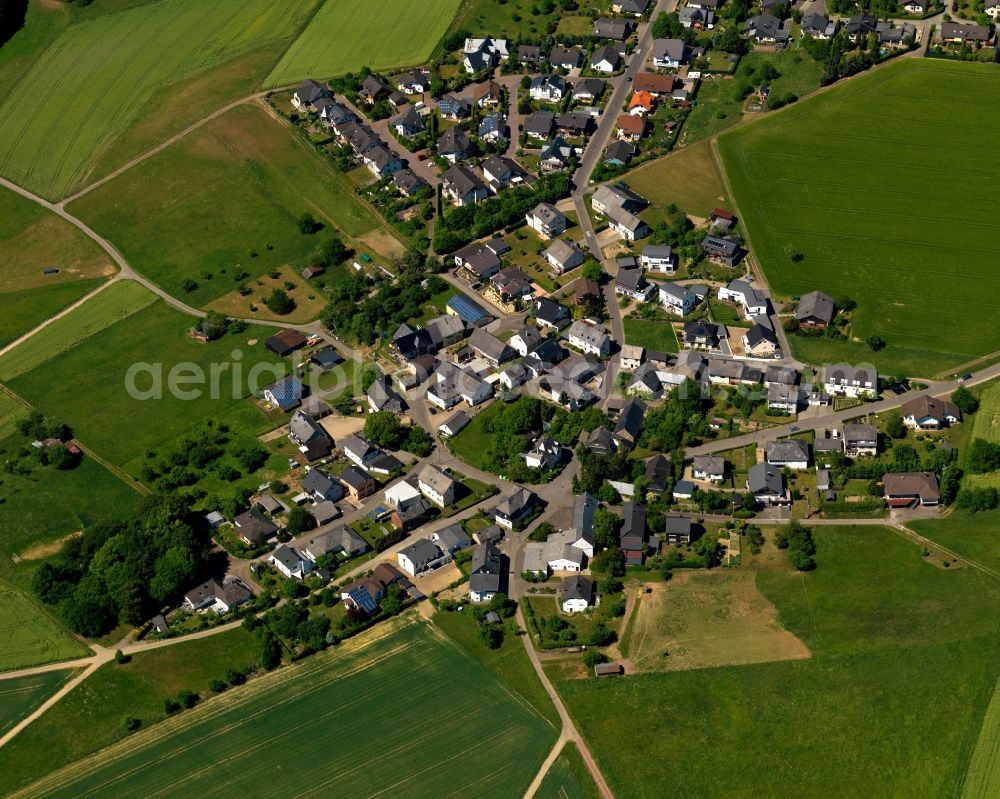 Emmelshausen from above - View of the Basselscheid part of the town of Emmelshausen in the state of Rhineland-Palatinate. The town is an official spa resort in the county district of Rhine-Hunsrueck, surrounded by fields, meadows and forest