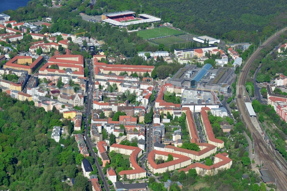 Aerial image Berlin - View of the Berlin-Koepenick part of the district of Treptow-Koepenick in Berlin. The northern most part of Koepenick is located on the edge of the Wuhlheide forest region and is the site of the football stadium An der alten Foersterei, the home stadium of the 1st FC Union Berlin, which is located on the An der Wuhlheide street. The shopping mall Forum Koepnick is located adjacent to the railway tracks