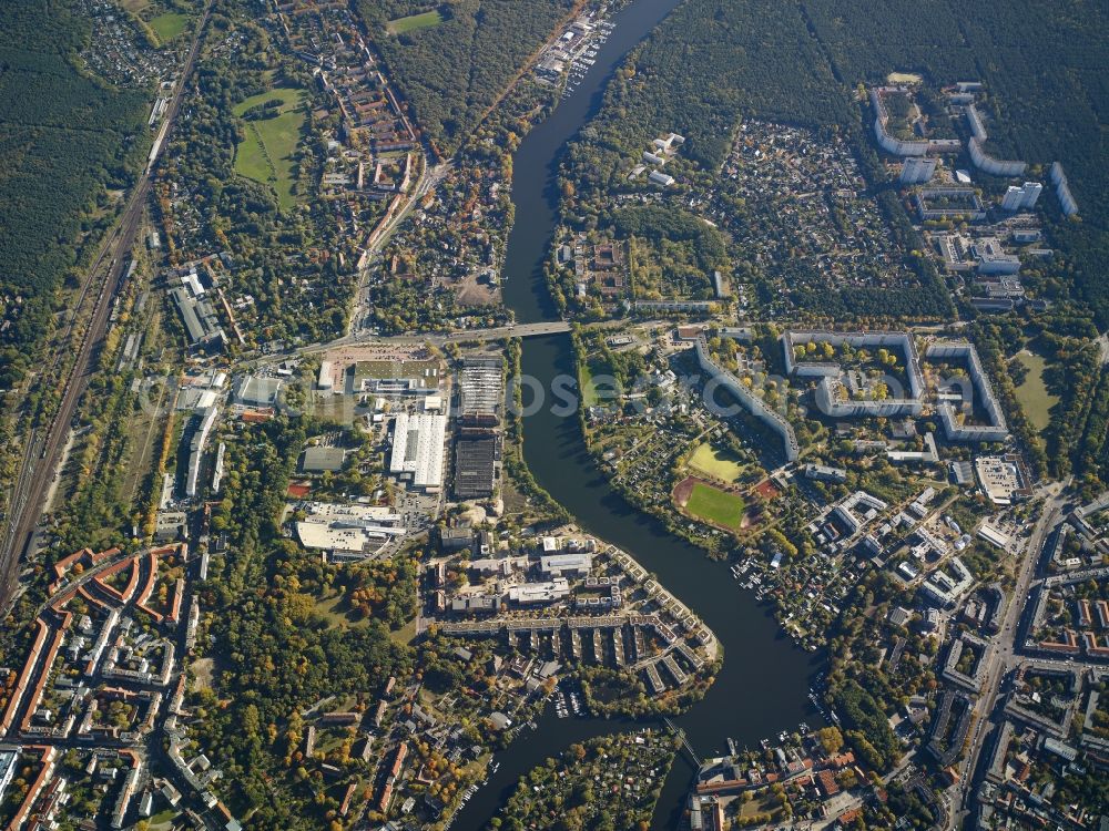 Aerial photograph Berlin - View of the river Mueggelspree in the Berlin-Koepenick part of the district of Treptow-Koepenick in Berlin. Several sports facilities, appartment blocks and estates and commerce areas are located on the Mueggelspree part of the river Spree, in the East of Koepenick. The Salvador-Allende bridge spans the river and joins the Friedrichshagener Strasse and Fuerstenwalder Damm in the North of the river