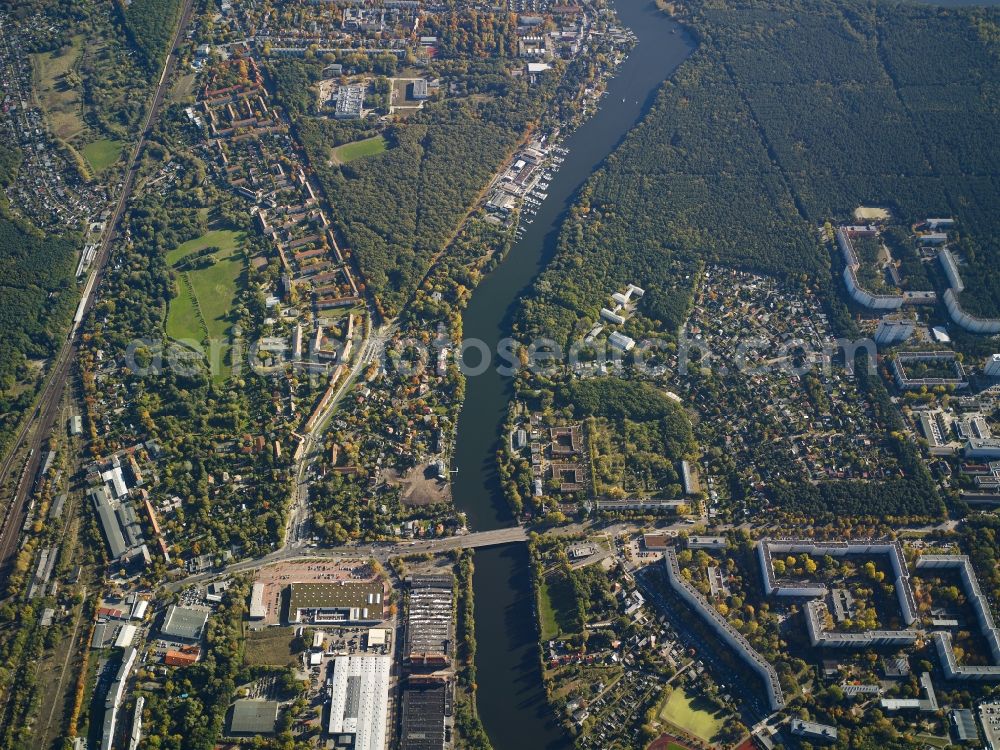 Berlin from above - View of the river Mueggelspree in the Berlin-Koepenick part of the district of Treptow-Koepenick in Berlin. Several sports facilities, appartment blocks and estates and commerce areas are located on the Mueggelspree part of the river Spree, in the East of Koepenick. The Salvador-Allende bridge spans the river and joins the Friedrichshagener Strasse and Fuerstenwalder Damm in the North of the river