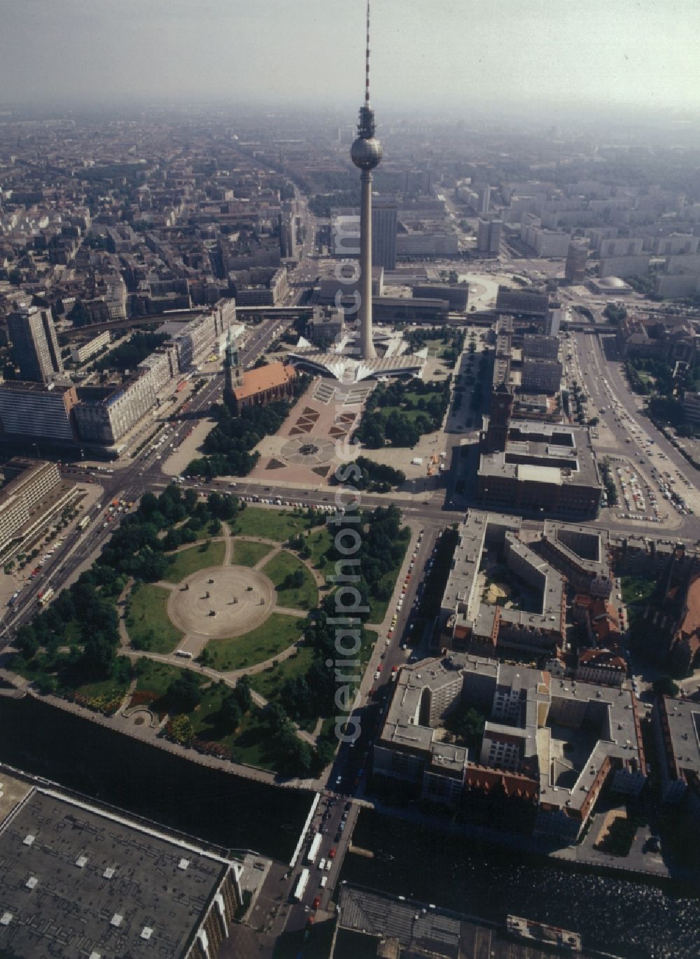 Aerial photograph Berlin - City partial view of central Berlin. In the foreground the park of the Marx-Engels-Forum. Farther to the left is the St. Mary's Church. Central in the picture is the back of the television tower