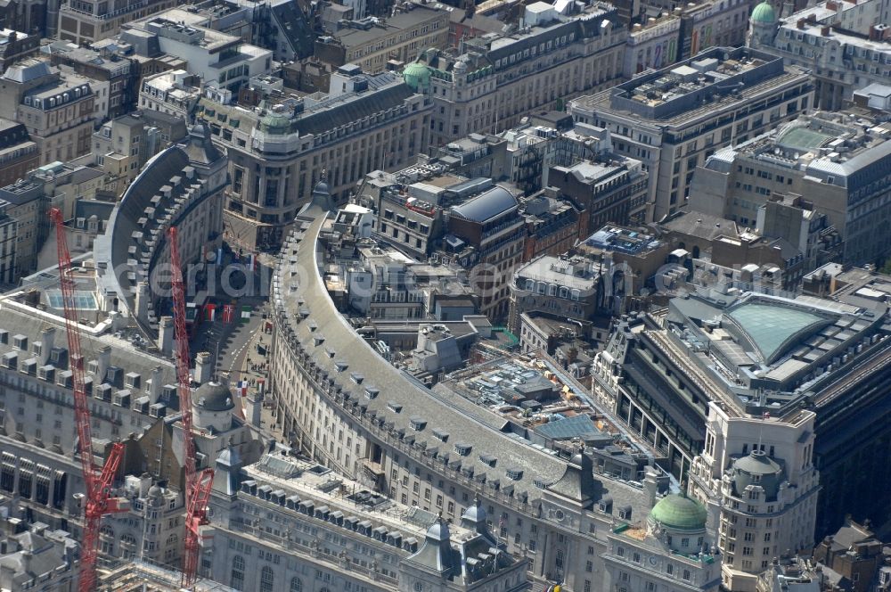 London from above - Sight on the office and business area in the quarter Greater London. View on the semicircular building with companies as Swan Gardens for secretarial services in the main shopping street and arterial road Regent Street in London, which is popular with tourists