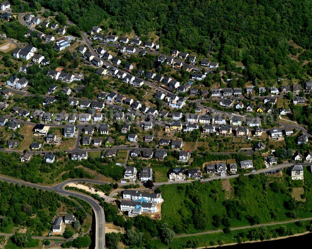 Cochem from above - View of the town of Cochem and the course of the river Mosel in the state of Rhineland-Palatinate. Cochem is the largest town of the Cochem-Zell county district and is located in a bend of the river, surrounded by woods and hills. The official tourist resort consists of Sehl and the town centre on the left riverbank of the Mosel which is visible here