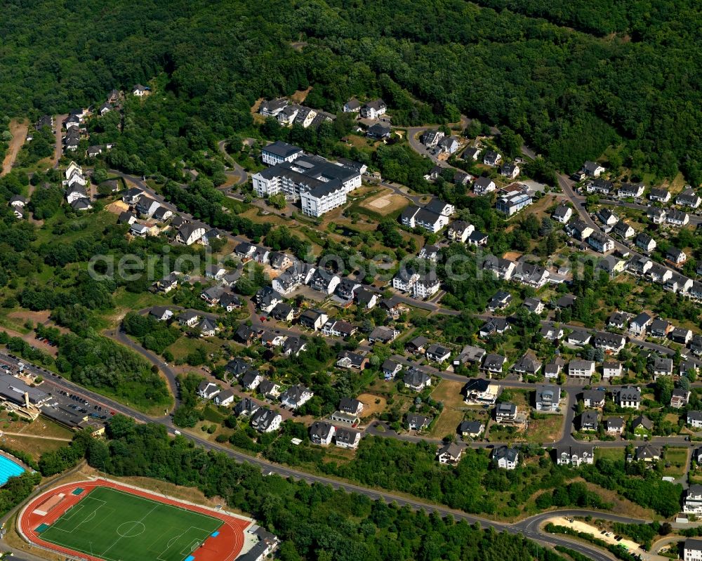 Aerial image Cochem - View of the town of Cochem and the course of the river Moselle in the state of Rhineland-Palatinate. Cochem is the largest town of the Cochem-Zell county district and is located in a bend of the river, surrounded by woods and hills. The official tourist resort includes sports facilities in the North of the town, located right on the riverbank