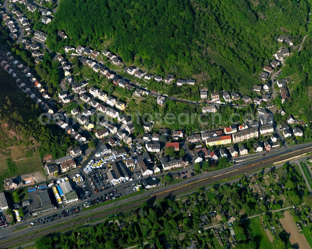 Braubach from the bird's eye view: View of the Im Einmuth part of Braubach in the state Rhineland-Palatinate. The town is located in the county district of Rhine-Lahn, on the right riverbank of the Rhine. The official tourist resort sits in the UNESCO world heritage site of Upper Middle Rhine Valley. Im Einmuth is a small residential area in the valley of the Schlierbach creek in the North of the Rhine