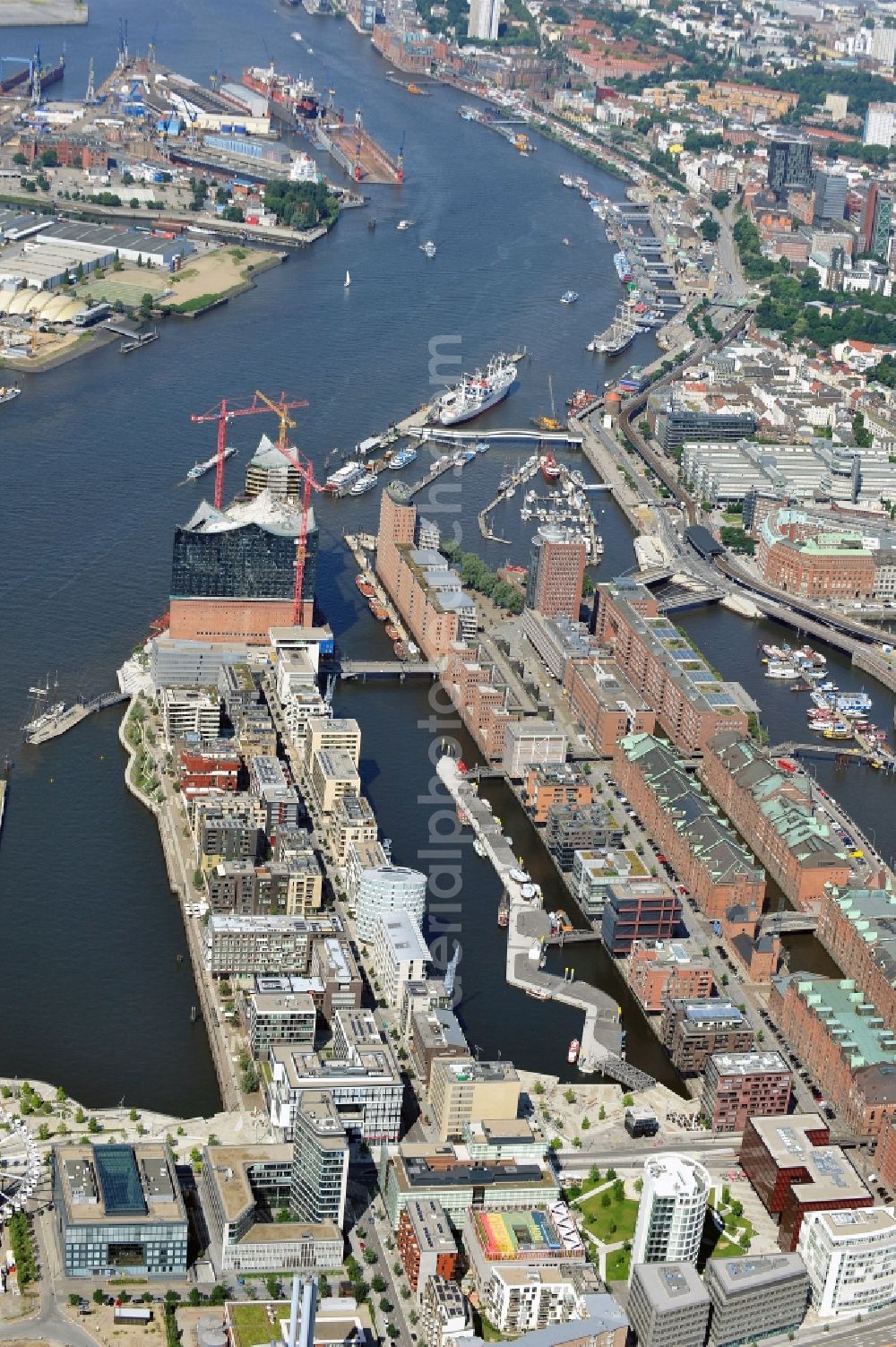 Aerial image Hamburg - View of waterfront Hafencity in Hamburg. Hafencity is a district in the middle of Hamburg. It exists of the area of the Großer Grasbrook, the northern part of the former isle Grasbrook, and the Speicherstadt on the former isles Kehrwieder and Wandrahm