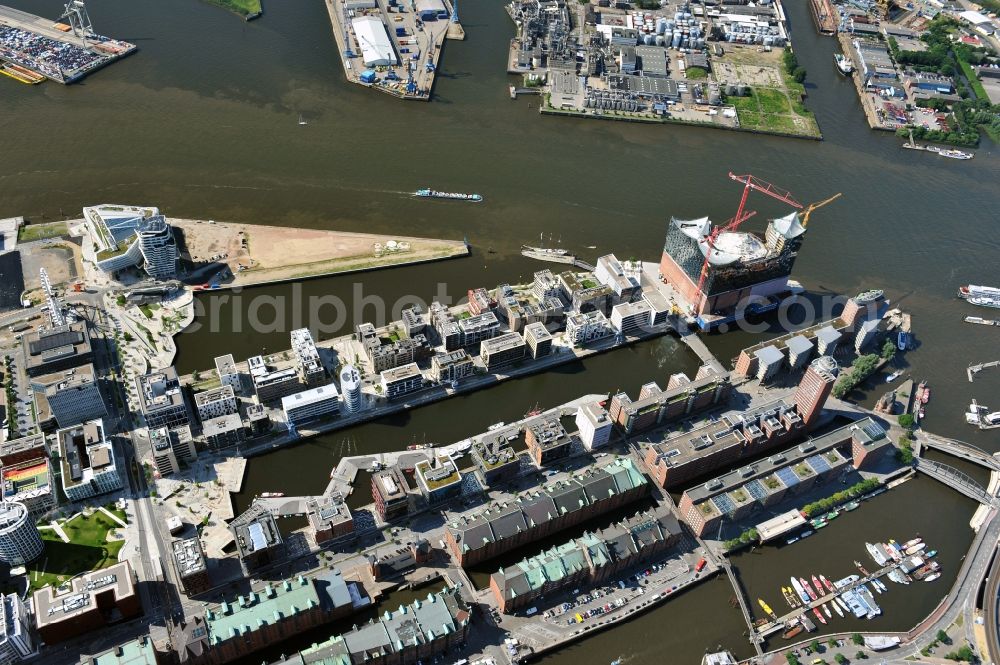 Aerial photograph Hamburg - View of waterfront Hafencity in Hamburg. Hafencity is a district in the middle of Hamburg. It exists of the area of the Großer Grasbrook, the northern part of the former isle Grasbrook, and the Speicherstadt on the former isles Kehrwieder and Wandrahm