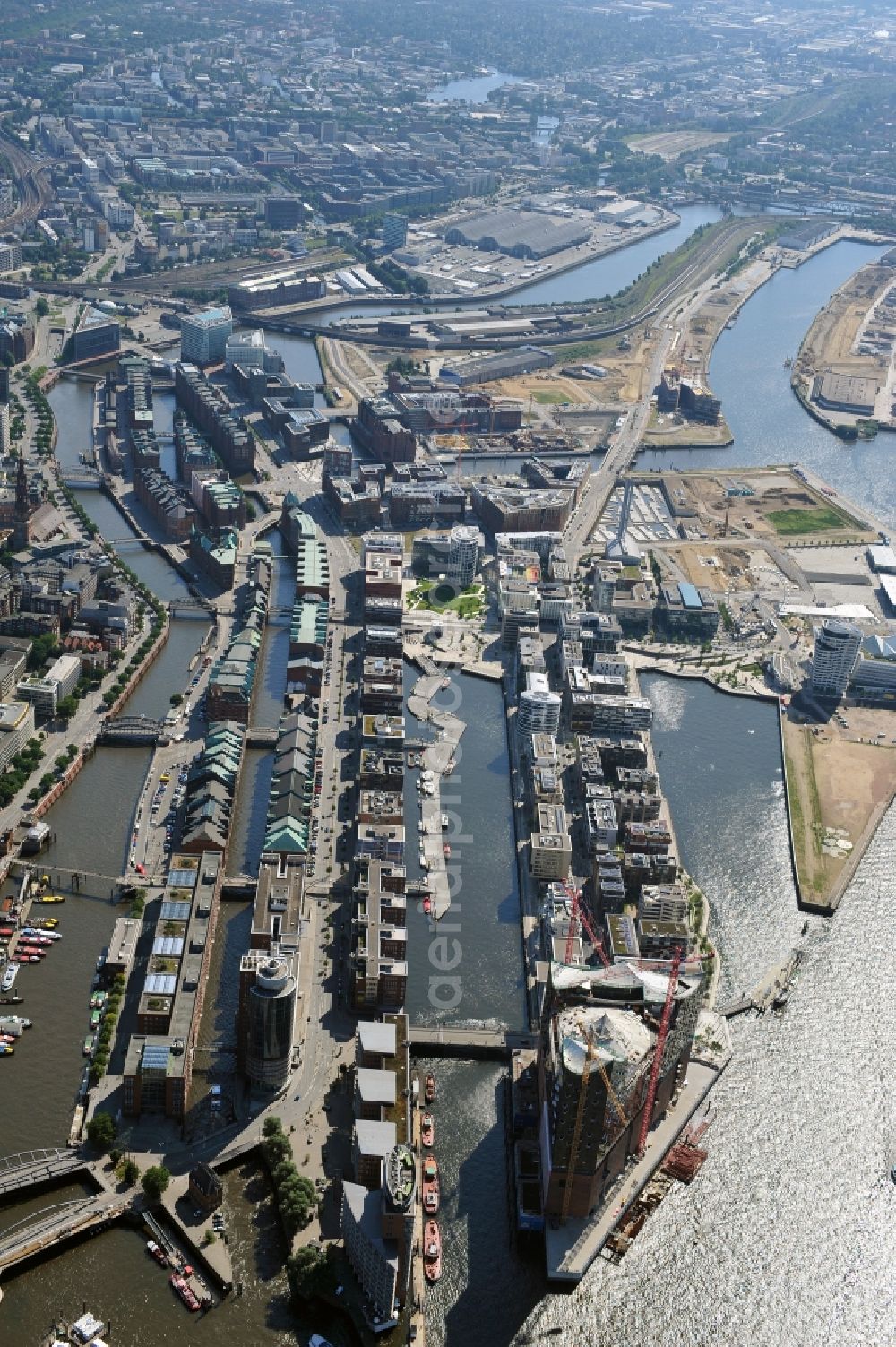 Aerial image Hamburg - View of waterfront Hafencity in Hamburg. Hafencity is a district in the middle of Hamburg. It exists of the area of the Großer Grasbrook, the northern part of the former isle Grasbrook, and the Speicherstadt on the former isles Kehrwieder and Wandrahm