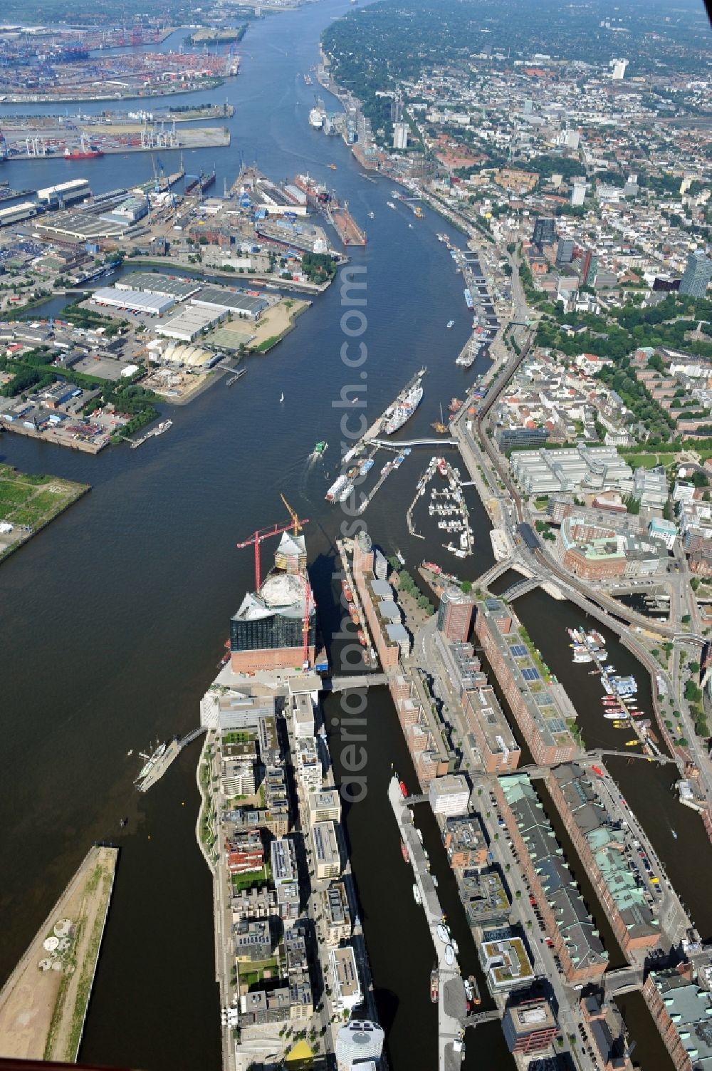 Aerial image Hamburg - View of waterfront Hafencity in Hamburg. Hafencity is a district in the middle of Hamburg. It exists of the area of the Großer Grasbrook, the northern part of the former isle Grasbrook, and the Speicherstadt on the former isles Kehrwieder and Wandrahm